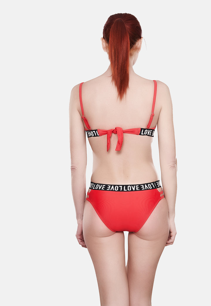 Costume da bagno bikini da donna colore rosso imbottito con ferretto e con elastico e scritta "love"