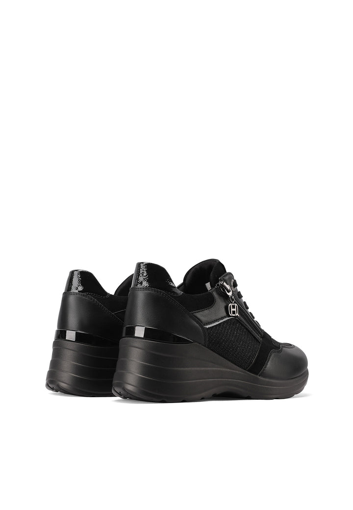 Sneakers da donna nere con zeppa in gomma e zip laterale, stile elegante